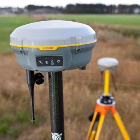 Trimble R8 RTK GNSS receiver on a tripod in the field